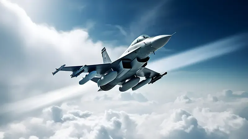 A modern fighter jet flying through a sky with clouds and sunbeams. The aircraft is armed with missiles.