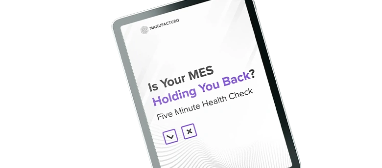 Tablet screen displaying Manufacturo logo. Text asks Is Your MES Holding You Back? Five Minute Health Check. Checkmark and X icons below.