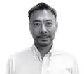 Headshot of Kenzo Takai, Chief Operations Officer, wearing a white button-down shirt. He has short, dark hair and a goatee.